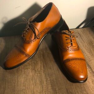 The shoes’s brand is Timur, size 10.5, material of the shoes is leather